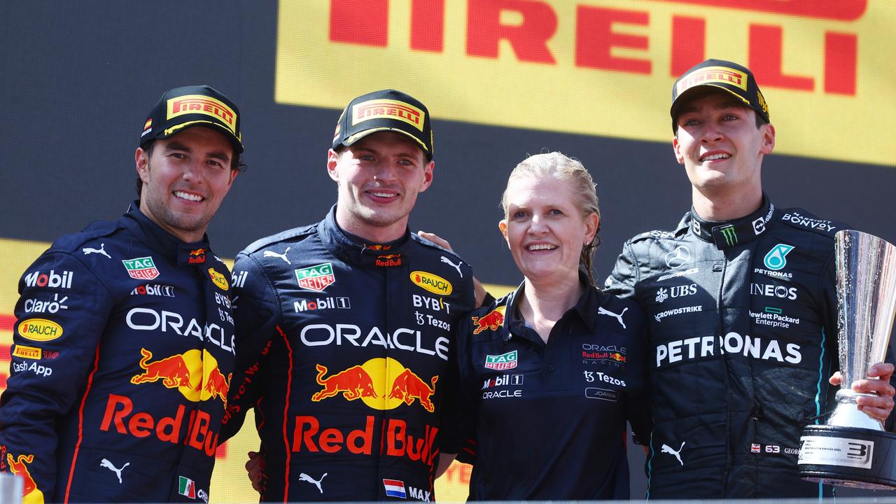 Race winner Max Verstappen with Sergio Perez and George Russell. Photo by Mark Thompson/Getty Images