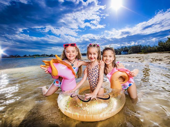 Gold Coast kids Pipper Tucker, 9, Lennon Wager, 6, and Ayanah Heron, 9 kick off the school holidays at The Spit. Picture: Nigel Hallett