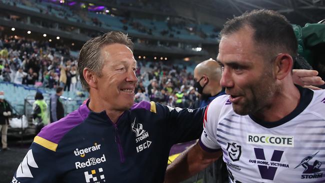 Craig Bellamy (L) celebrates winning last year’s grand final with Cameron Smith. Picture: Cameron Spencer/Getty