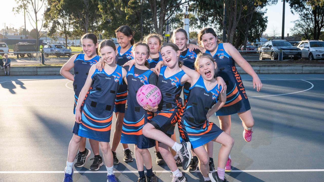 Armstrong Creek Blue Sharks under-11 netball team pull their funniest faces.