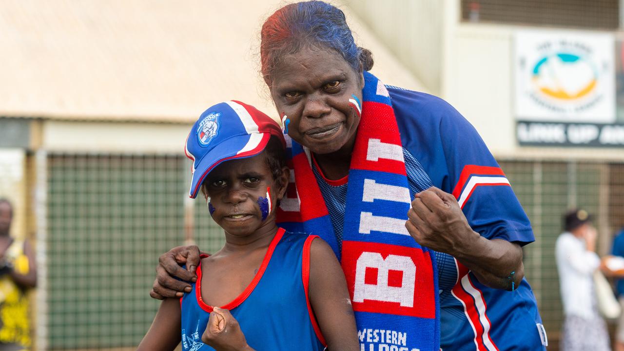 The Tiwi Islands 2020-2021 Grand Final. The Imalu Tigers take on the Walama Bulldogs on Bathurst Island. Bulldogs supporters James Pilakui, 9 and Monica Pilakui. Photograph: Che Chorley