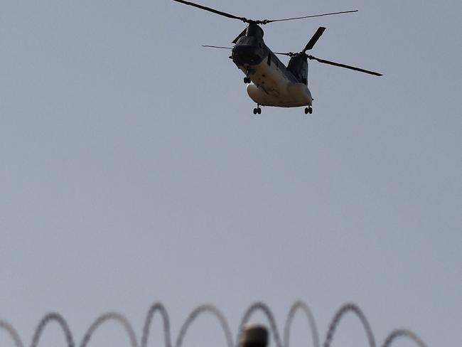 A US military helicopter is pictured flying above the US embassy in Kabul. Picture: AFP