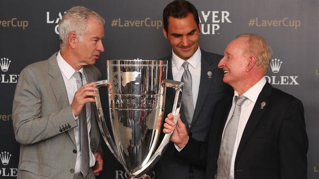 (l-r) John McEnroe, Roger Federer and Rod Laver with the Rod Laver Cup at Wimbledon on Thursday.