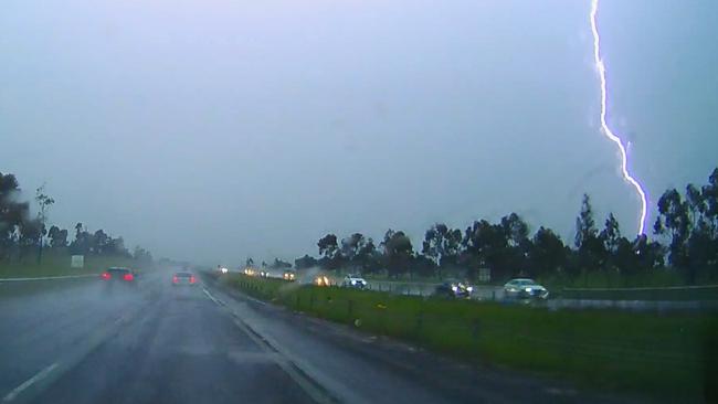 Lightning is seen on the Calder Hwy on Tuesday afternoon. Picture: Jason Edwards