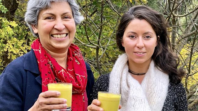 Photos by Elaine Reeves for her Taste column in the Mercury.Lynette, left, and Selina Heywood with turmeric lattes laced with Golden Caramel Ghee.