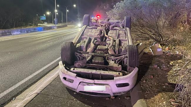 The white Holden sedan rolled on the Freeway on Monday evening. Picture: SA Police