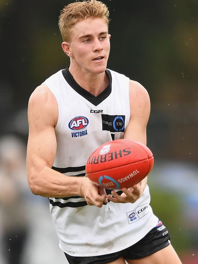 Northern Knights midfielder Tom McKenzie gets a handball away. Picture: Getty Images.