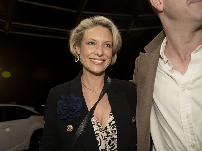 Katherine Deves arrives, guided by a Liberal Party HQ minder, at the meet the candidates forum at Forestville RSL last Friday night. Picture: Nikki Short