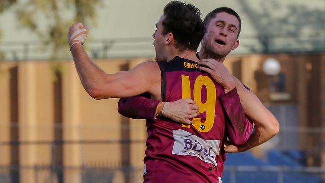 Riley Thompson and Durras Seccull celebrate a goal for Old Haileybury this year in the VAFA.