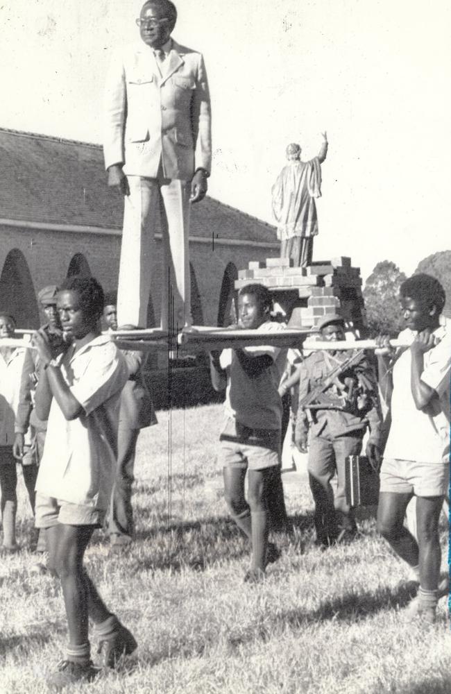 Robert Mugabe is carried by schoolboys past the Roman Catholic Mission, where he was born and educated, in 1980. Picture: UPI