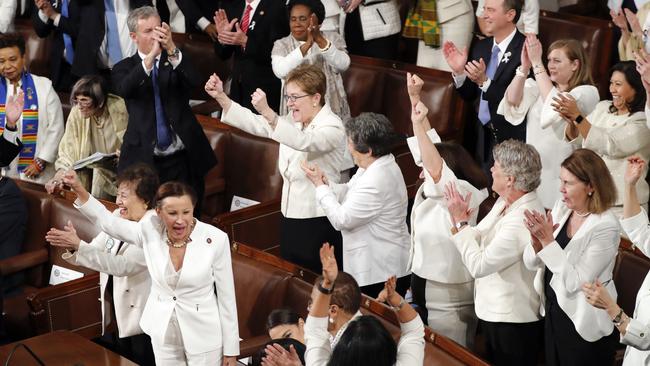 Members of Congress, many of them women dressed in white, cheer after President Donald Trump acknowledges them. Picture: AP