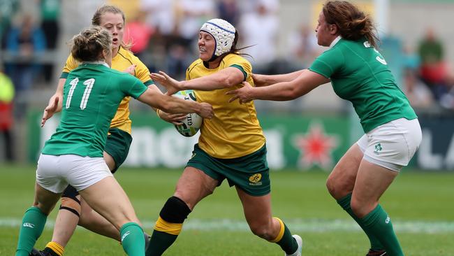 BELFAST, NORTHERN IRELAND - AUGUST 22: Sharni Williams of Australia is tackled by Alison Miller (L) and Ailis Egan during the Women's Rugby World Cup 2017 match between Ireland and Australia at the Kingspan Stadium on August 22, 2017 in Belfast, United Kingdom. (Photo by David Rogers/Getty Images)