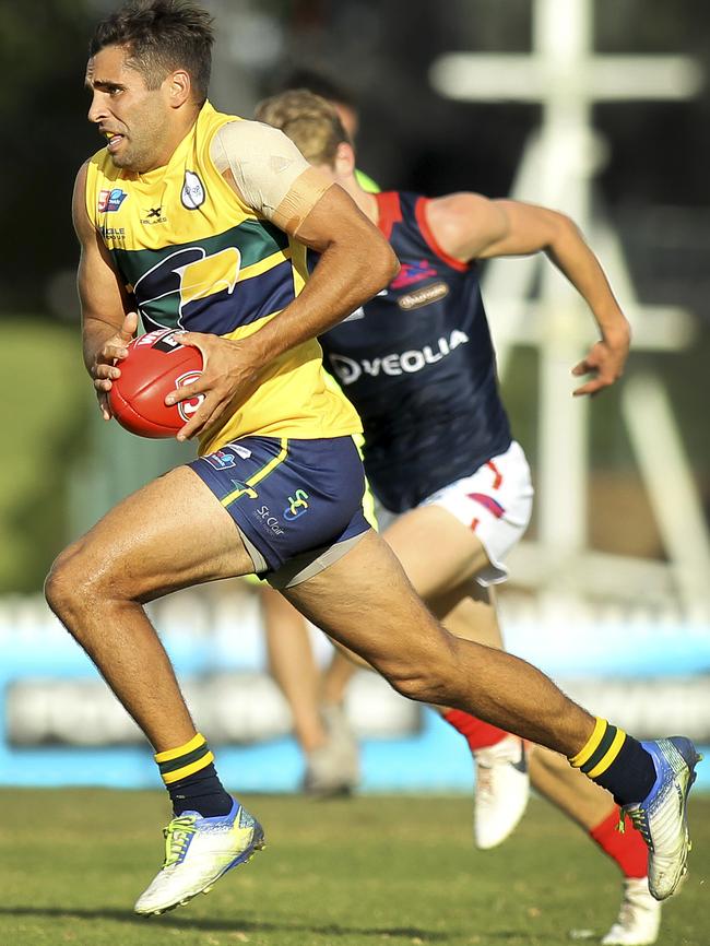 Eagles livewire Jared Petrenko takes a run down the centre of the oval to have a shot at goal. Picture: AAP/Dean Martin