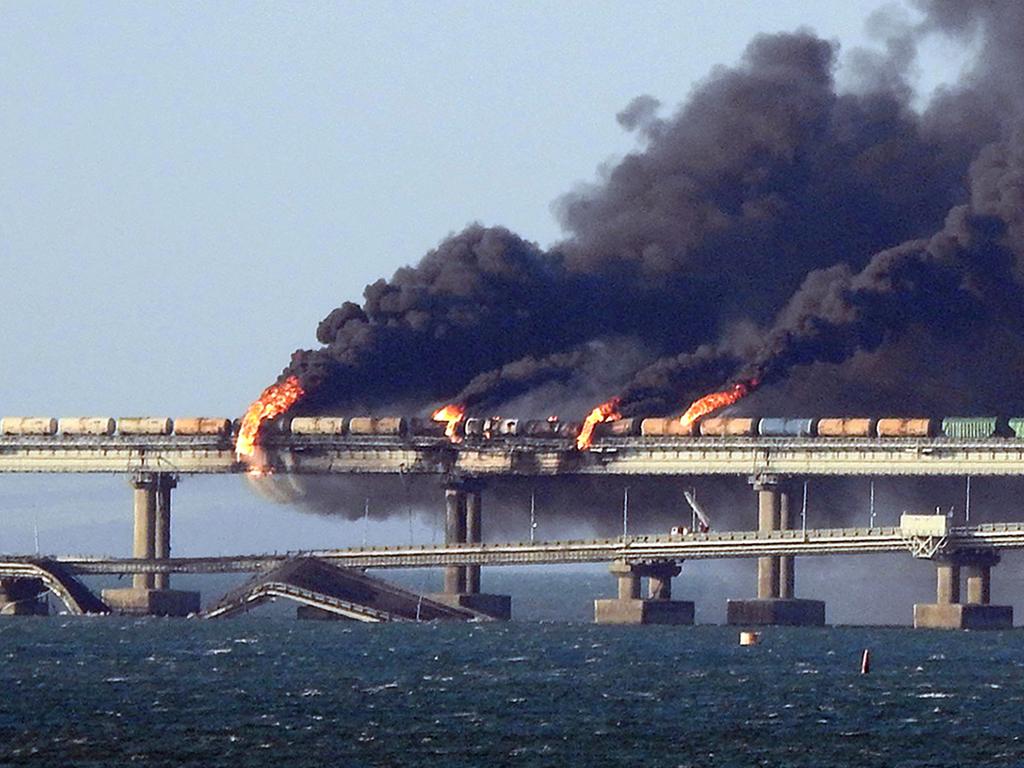 Black smoke billows from a fire on the Kerch bridge that links Crimea to Russia, after a truck exploded, near Kerch, on October 8, 2022. Picture: AFP