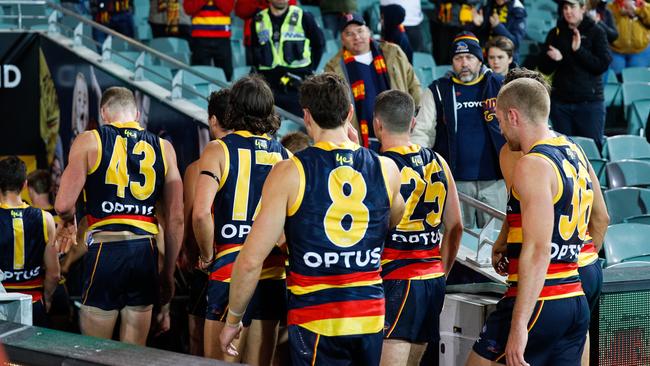 Adelaide players leave the field after losing to St Kilda on Monday night – their seventh straight loss for the year. Picture: Daniel Kalisz/Getty Images