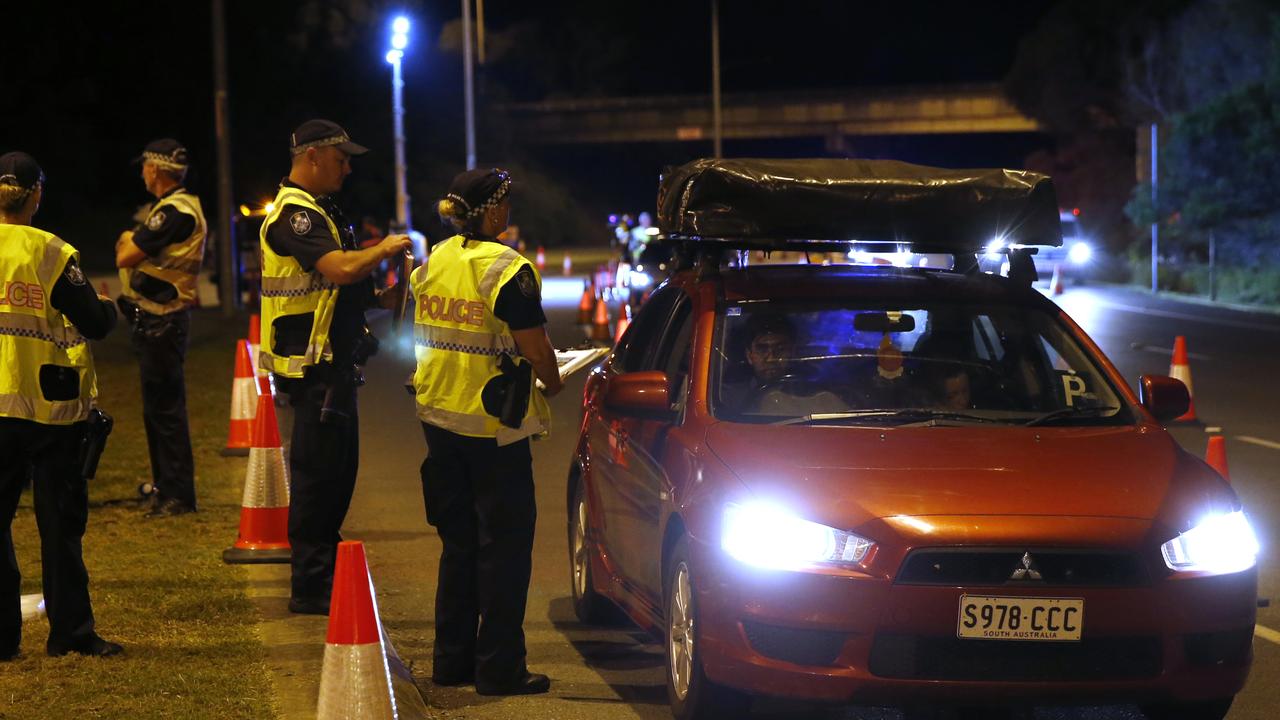 Police stop a vehicle at a roadblock near the Queensland-NSW border on the Gold Coast Highway on March 26. Picture: Regi Varghese