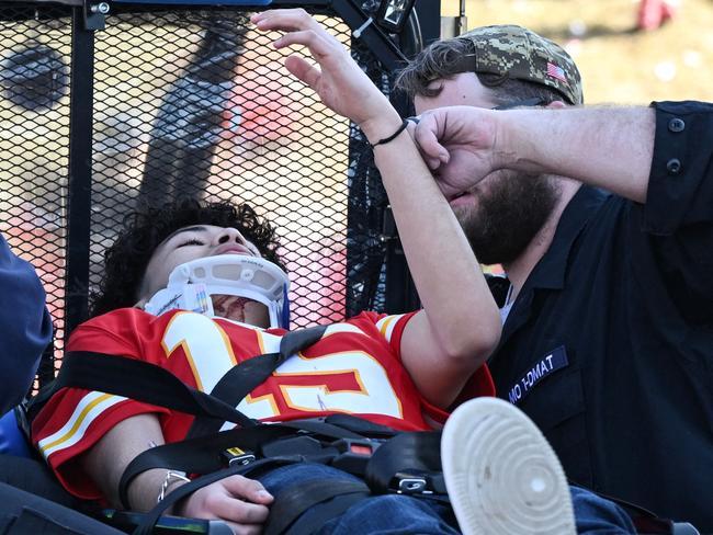 An injured person is aided near the Kansas City Chiefs' Super Bowl LVIII victory parade in Kansas City, Missouri. Picture: AFP