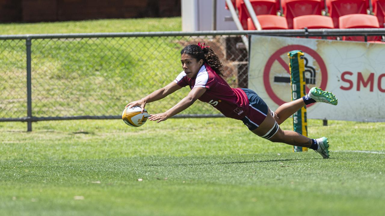 Fleur Ginn gets a Queensland Reds try as Downs Rugby host Next Gen 7s at Toowoomba Sports Ground, Saturday, October 12, 2024. Picture: Kevin Farmer