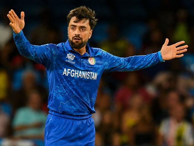 Afghanistan's captain Rashid Khan appeals for a wicket during the ICC men's Twenty20 World Cup 2024 Super Eight cricket match between Afghanistan and Australia at Arnos Vale Stadium in Arnos Vale, Saint Vincent and the Grenadines on June 22, 2024. (Photo by Randy Brooks / AFP)