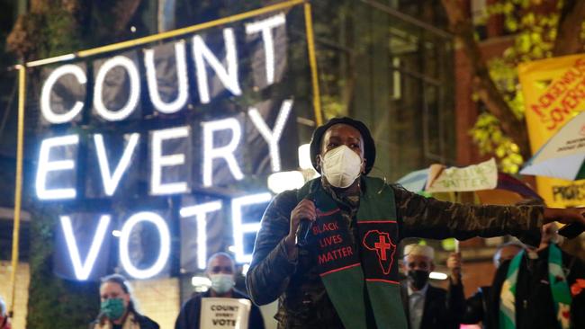 Protesters in the US with their “Count Every Vote” slogan. Picture: Jason Redmond/AFP