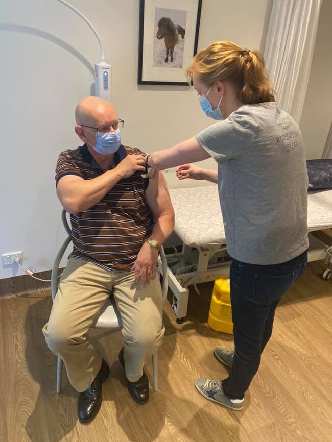 Blair MP Shayne Neumann gets the first jab of the AstraZeneca vaccine at Colleges Crossing Family Practice.