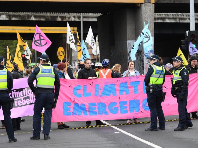 Activists from Extinction Rebellion block Melbourne’s King Street on Thursday. Picture: AAP Image/Erik Anderson