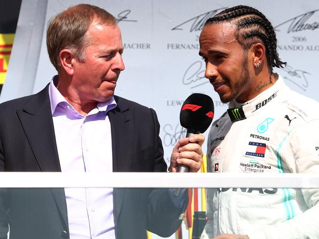 MONTREAL, QUEBEC - JUNE 09: Lewis Hamilton of Great Britain and Mercedes GP and Sebastian Vettel of Germany and Ferrari talk with Martin Brundle on the podium during the F1 Grand Prix of Canada at Circuit Gilles Villeneuve on June 09, 2019 in Montreal, Canada. (Photo by Mark Thompson/Getty Images)