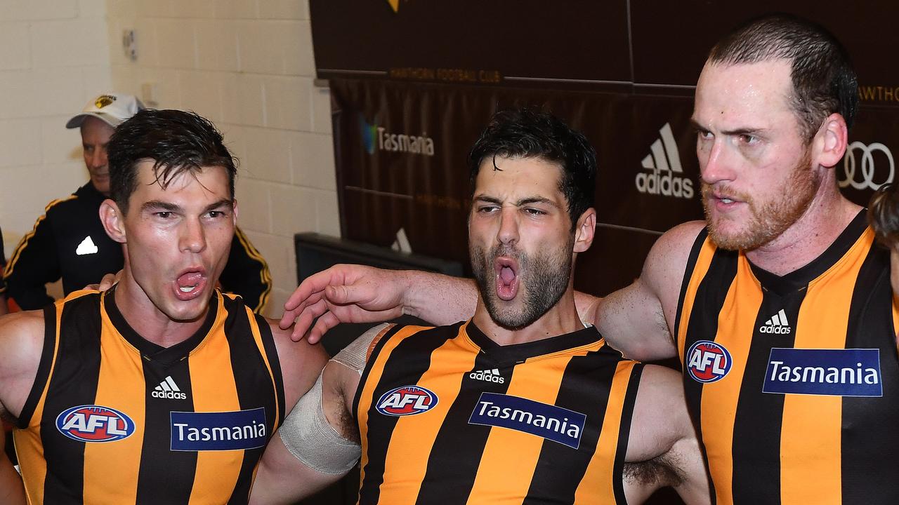 David Mirra celebrates the win with Jaeger O’Meara and Jarryd Roughead.