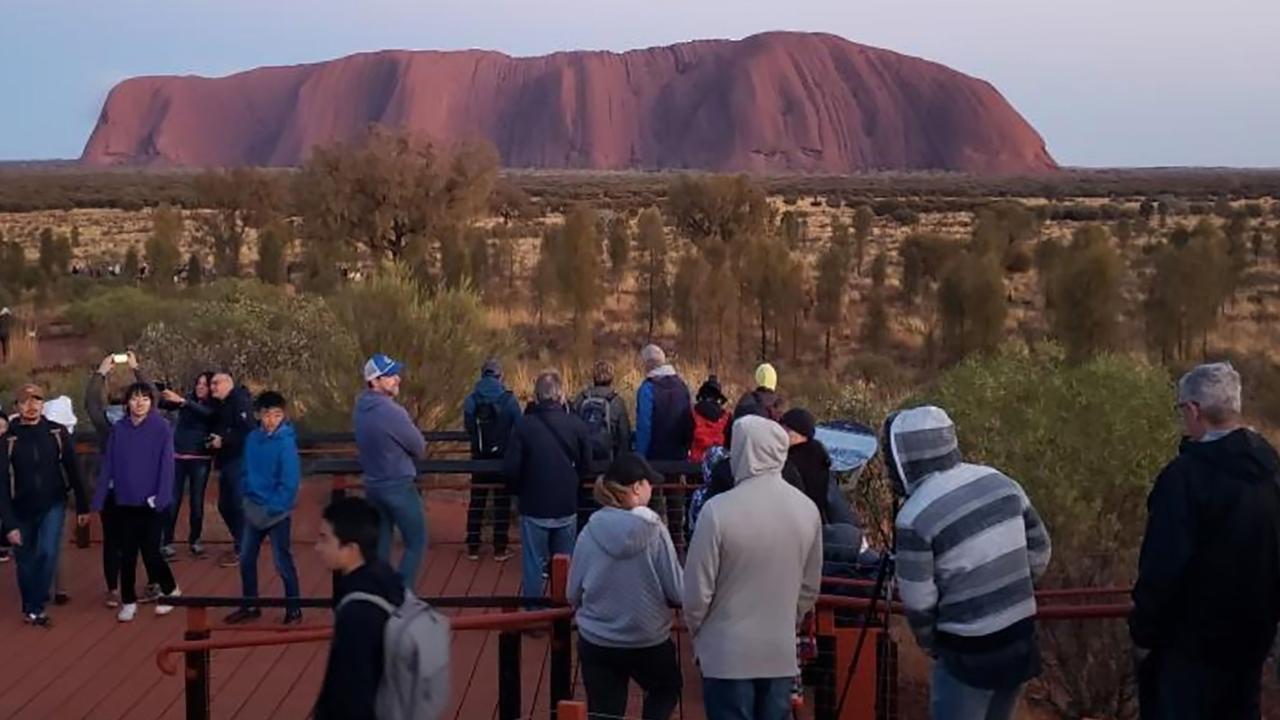 Large numbers of tourists are rushing to scale Uluru before the October 26 ban on climbing. Picture: @koki_mel_aus/AFP