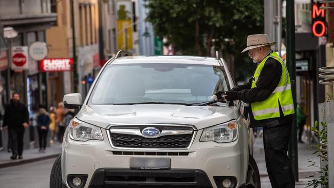 A parking inspector in the CBD. Picture: Jason Edwards