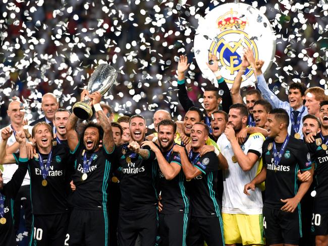 Real Madrid’s players celebrate with the trophy after winning the UEFA Super Cup final football match between Real Madrid and Manchester United on August 8, 2017, at the Philip II Arena in Skopje. Pictue: AFP PHOTO