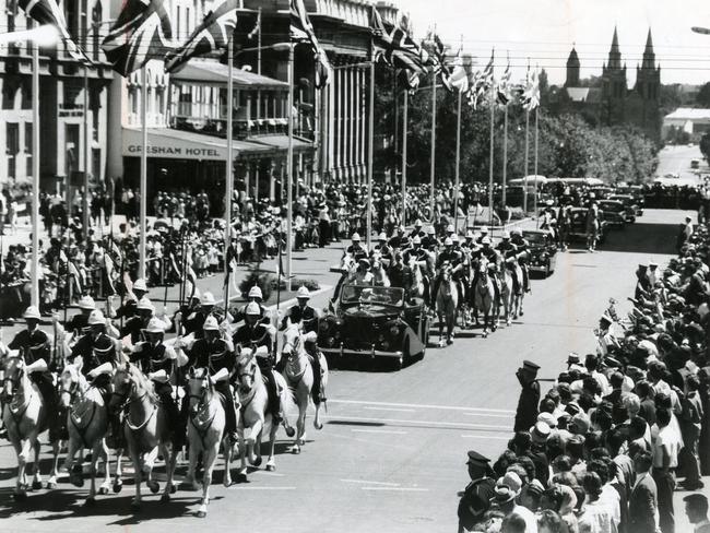 The Royal couple is escorted down King William Street by the SA Police Lancers.