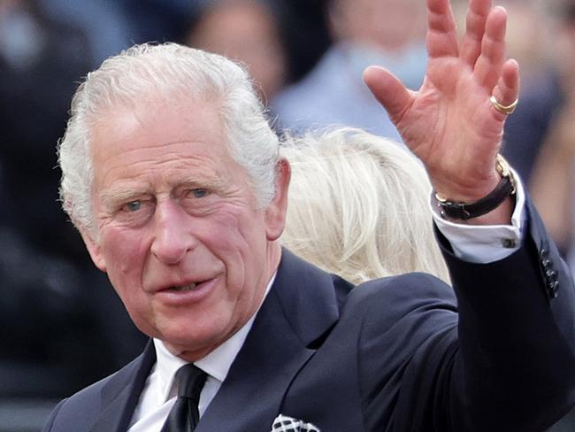 LONDON, ENGLAND - SEPTEMBER 09:  King Charles III waves to the public after viewing floral tributes to the late Queen Elizabeth II outside Buckingham Palace on September 09, 2022 in London, United Kingdom. Elizabeth Alexandra Mary Windsor was born in Bruton Street, Mayfair, London on 21 April 1926. She married Prince Philip in 1947 and acceded the throne of the United Kingdom and Commonwealth on 6 February 1952 after the death of her Father, King George VI. Queen Elizabeth II died at Balmoral Castle in Scotland on September 8, 2022, and is succeeded by her eldest son, King Charles III. (Photo by Chris Jackson/Getty Images)