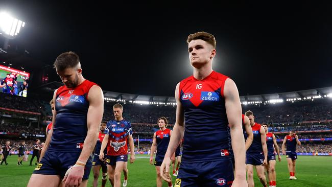 Bayley Fritsch and Joel Smith walk off the MCG on Friday night. Picture: Dylan Burns/AFL Photos via Getty Images