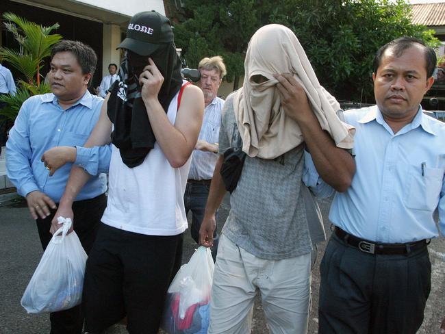 Officers escort two of the Bali Nine to the prison cell in Bali Police HQ. Picture: Lukman S Bintaro.