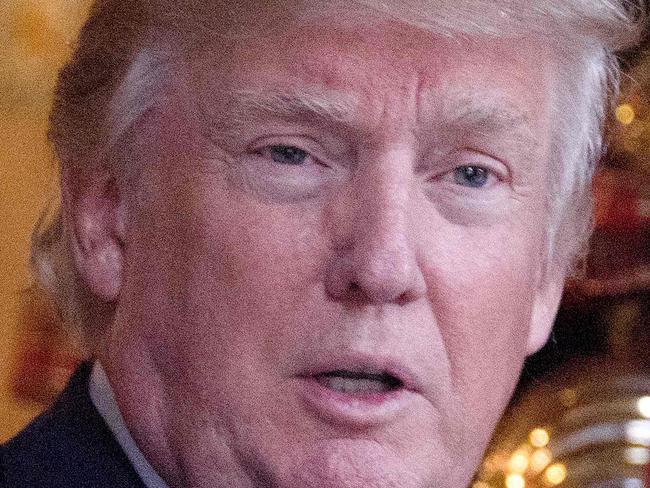 US President-elect Donald Trump speaks to reporters at Mar-a-Lago in Palm Beach, Florida where he is taking meetings on December 21, 2016. / AFP PHOTO / JIM WATSON