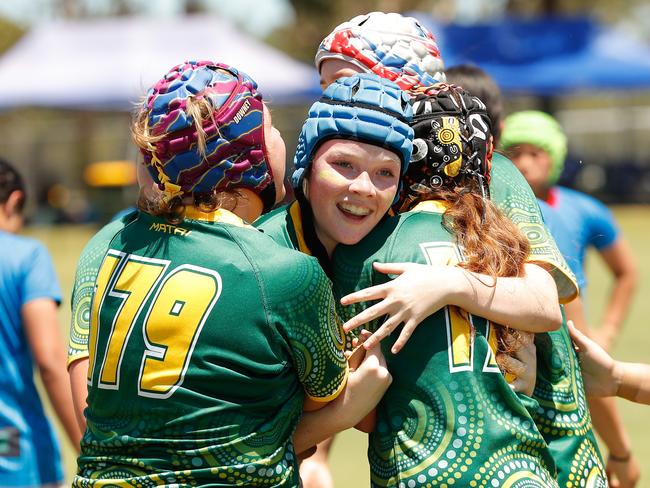 AU Superstars players celebrate after a try.