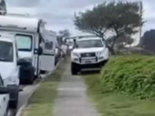 Stolen four wheel drive caught on camera driving along a footpath at Duranbah beach near Tweed Heads. Picture: Nick Atkins