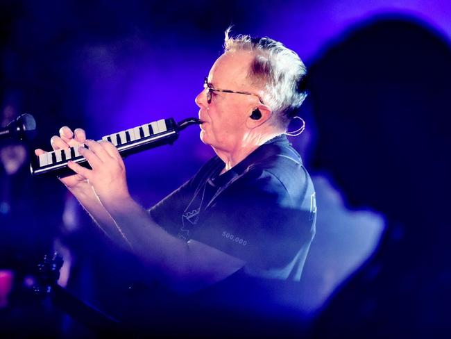Bernard Sumner plays the melodica at New Order's Brisbane show. Picture: Warren Jackson/Facebook