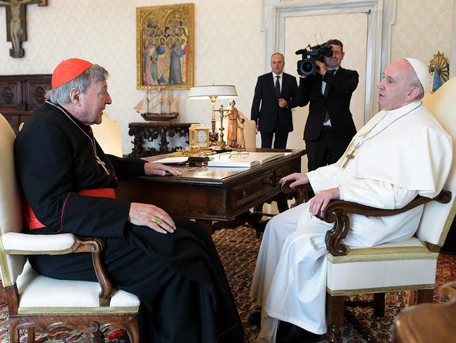 Pope Francis talking with Australian cardinal George Pell. Picture: AFP