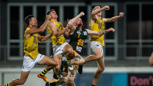 St Mary's Will Robinson competes for the ball against three Nightcliff players in Round 1 of the 2024-25 NTFL season. Picture: Pema Tamang Pakhrin