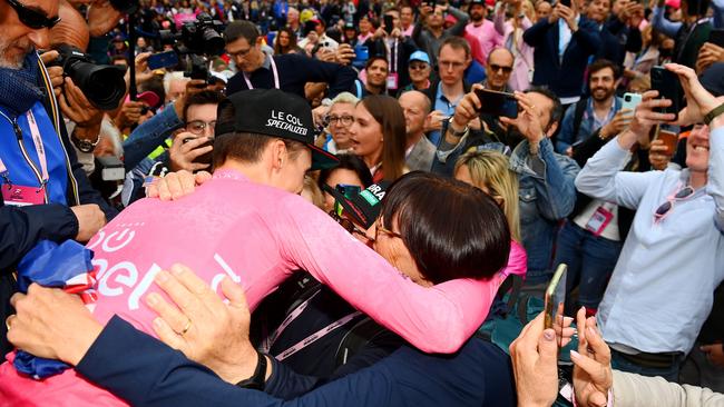 Hindley shares an emotional reunion with his parents Gordon and Robyn after winning the Giro. Picture: Getty