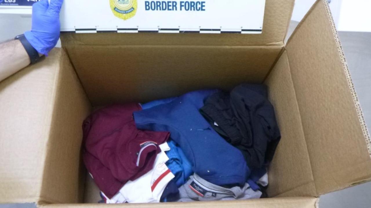 Drugs were concealed in the lining of a cardboard box filled with clothing.