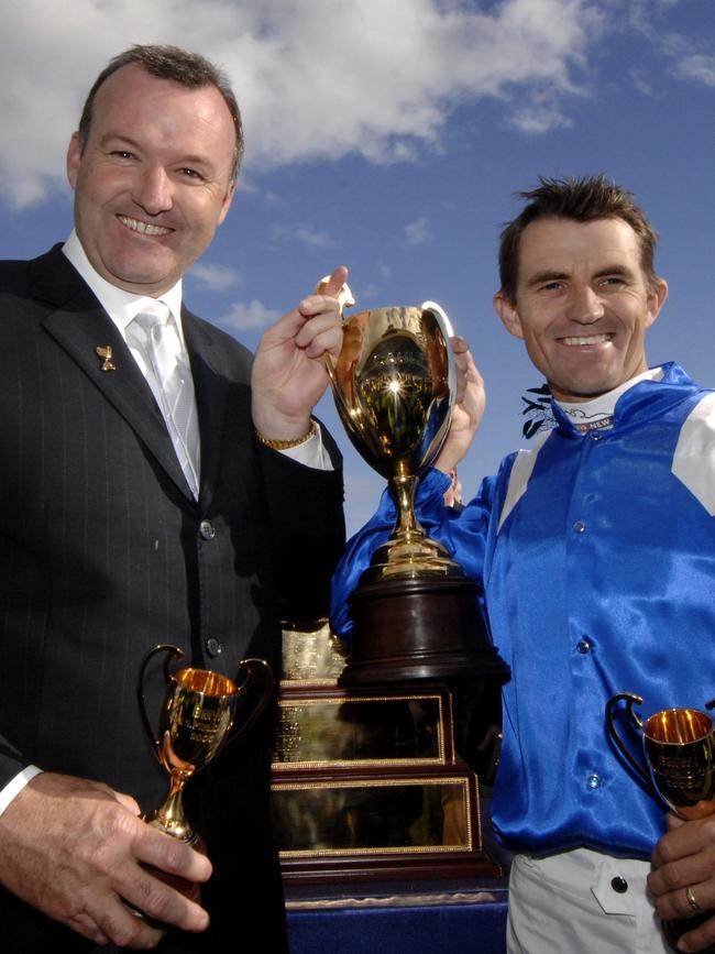 Dwayne Dunn and David Hayes celebrate with the Caulfield Cup after Tawqeet’s 2006 victory.