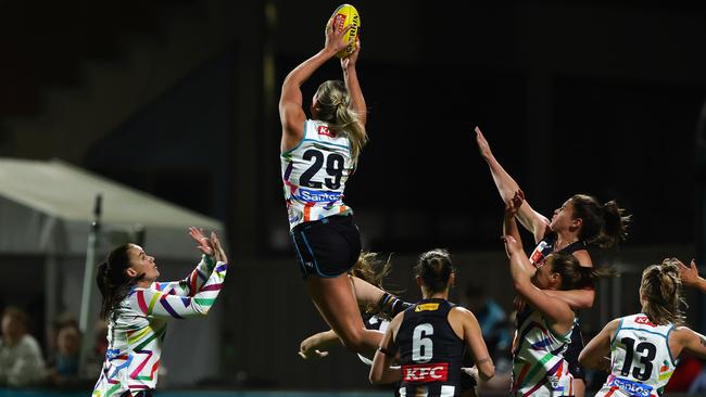 Port Adelaide ruck Matilda Scholz flies for a huge mark in the Power’s win over Collingwood at Alberton Oval on Thursday night. Picture: Sarah Reed / Getty Images