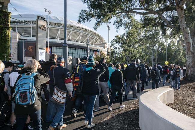 Crows and Port Adelaide fans walking into Adelaide Oval to be extras in film 