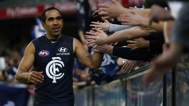 Eddie Betts high fives Carlton fans after an elimination final win in 2013. Picture: MICHAEL KLEIN