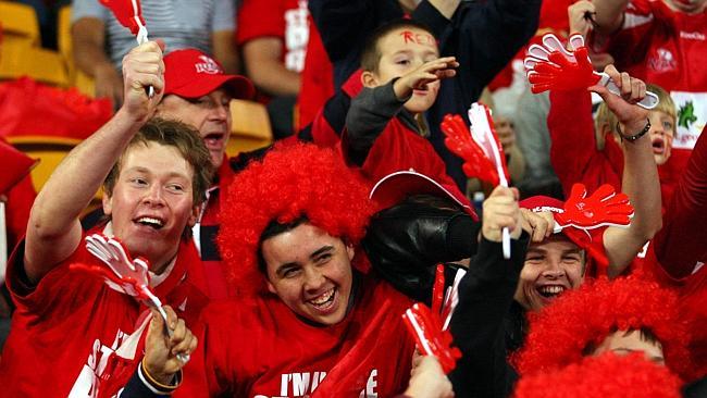 Reds fans celebrate at Suncorp Stadium. Picture: Darren England