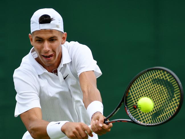 LONDON, ENGLAND - JULY 01: Alexei Popyrin of Australia plays a backhand in his Men's Singles first round match against Pablo Carreno Busta of Spain during Day one of The Championships - Wimbledon 2019 at All England Lawn Tennis and Croquet Club on July 01, 2019 in London, England. (Photo by Mike Hewitt/Getty Images)