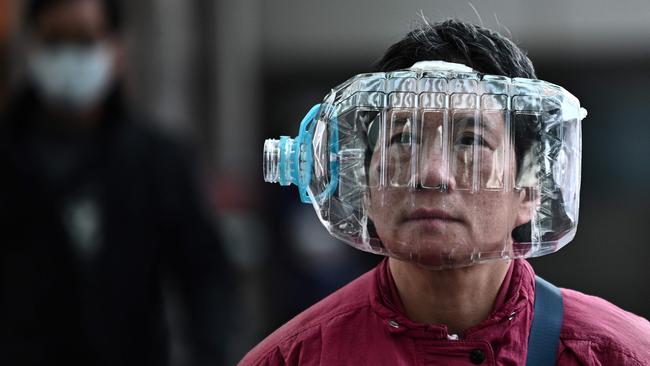 A woman with a home-made solution to COVID-19 protection in Hong Kong in January 31. Picture: AFP